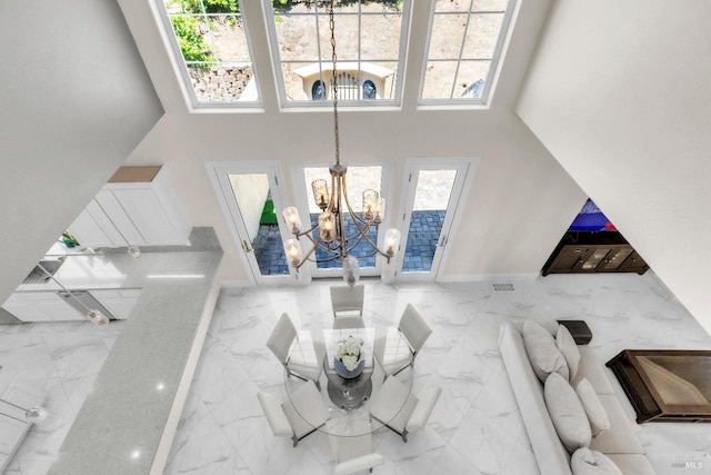 955 Appleridge Pl, Fairfield, CA 94534 - living room with a chandelier, plenty of natural light, marble finish floors, and a high ceiling