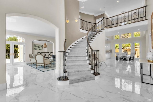 955 Appleridge Pl, Fairfield, CA 94534 - foyer featuring french doors, arched walkways, marble tiled floors, stairway, and crown molding