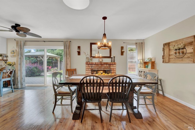 2783 Vista Palomar, Fairfield, CA 94534 - dining space featuring wood finished floors, ceiling fan, a chandelier, and a fireplace