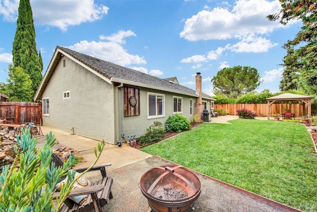 2783 Vista Palomar, Fairfield, CA 94534 - back of house with a fire pit, a gazebo, a patio, and a fenced backyard