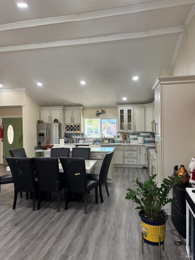 3418 Astoria Ct, Fairfield, CA 94534 - dining area featuring light wood finished floors, crown molding, and recessed lighting