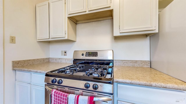 312 12th St, Petaluma, CA 94954 - kitchen with stainless steel gas stove, light countertops, and white cabinetry