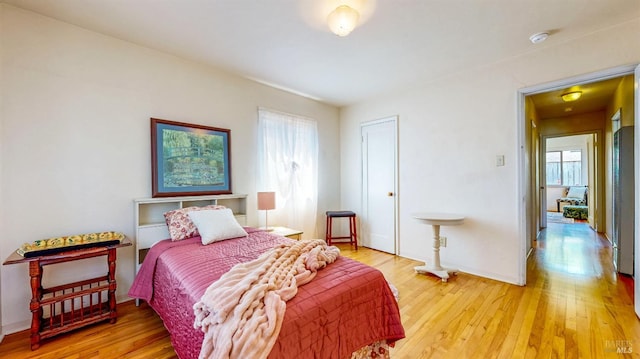 312 12th St, Petaluma, CA 94954 - bedroom featuring multiple windows, light wood-style flooring, and a heating unit