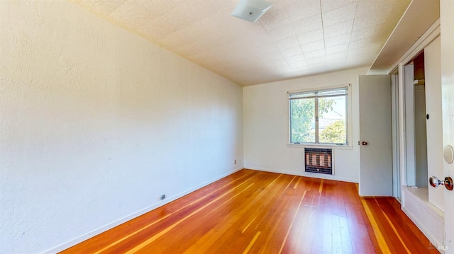 312 12th St, Petaluma, CA 94954 - empty room with hardwood / wood-style flooring and heating unit
