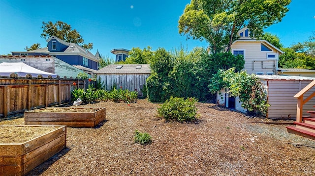 312 12th St, Petaluma, CA 94954 - fenced backyard featuring a garden and an outbuilding