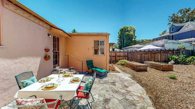 312 12th St, Petaluma, CA 94954 - fenced backyard featuring a patio area, outdoor dining space, and a garden