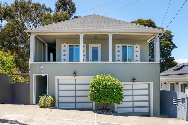 205 Cypress Ave, San Bruno, CA 94066 - bungalow-style house featuring stucco siding, an attached garage, and a balcony