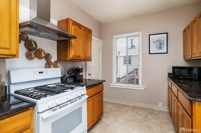 205 Cypress Ave, San Bruno, CA 94066 - kitchen with gas range gas stove, black microwave, wall chimney exhaust hood, dark stone countertops, and brown cabinetry