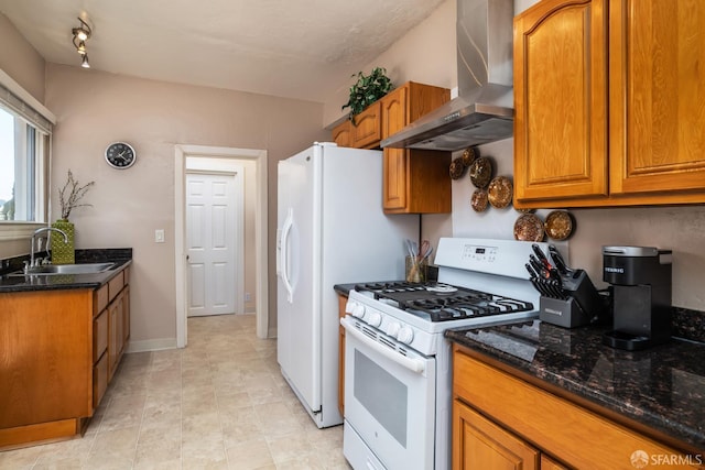 205 Cypress Ave, San Bruno, CA 94066 - kitchen with wall chimney exhaust hood, white gas stove, brown cabinetry, and dark stone countertops