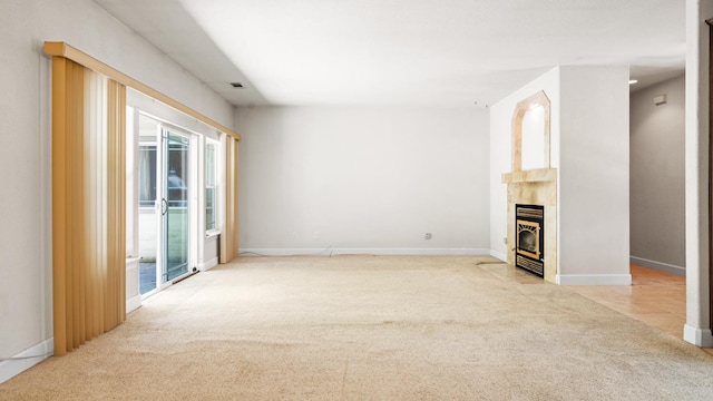 2077 Bourbon St, Pollock Pines, CA 95726 - empty room with light colored carpet and a tiled fireplace