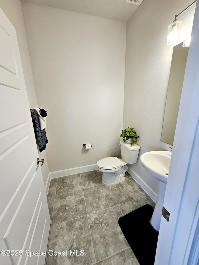 bathroom featuring toilet