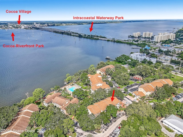 birds eye view of property with a water view