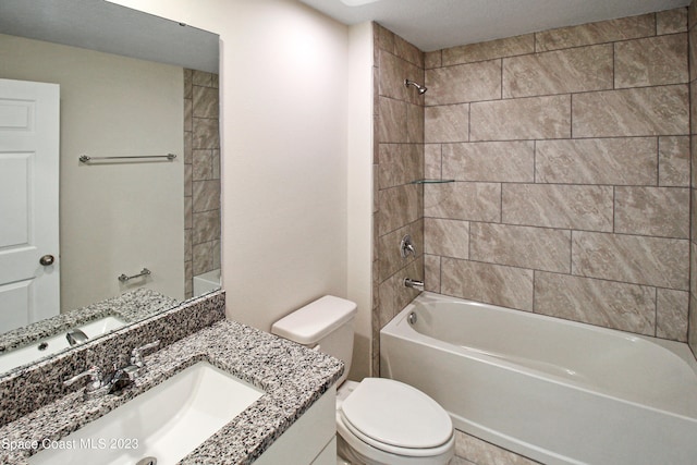 full bathroom with tiled shower / bath combo, vanity, and toilet