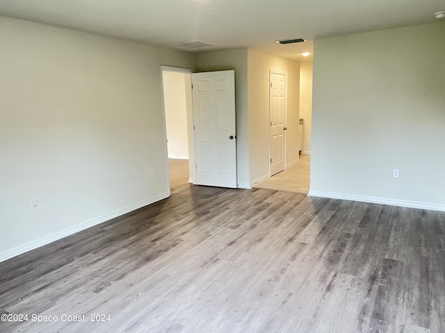 empty room featuring hardwood / wood-style flooring