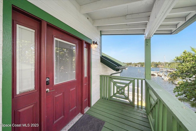 entrance to property with a water view