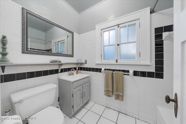 full bathroom with oversized vanity, bathtub / shower combination, toilet, tile walls, and tile floors