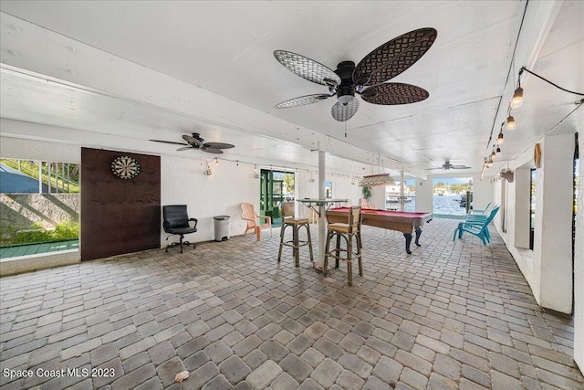 game room with ceiling fan, a wealth of natural light, and billiards