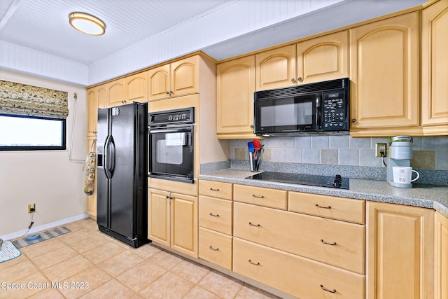 kitchen with backsplash, light brown cabinets, light tile floors, and black appliances