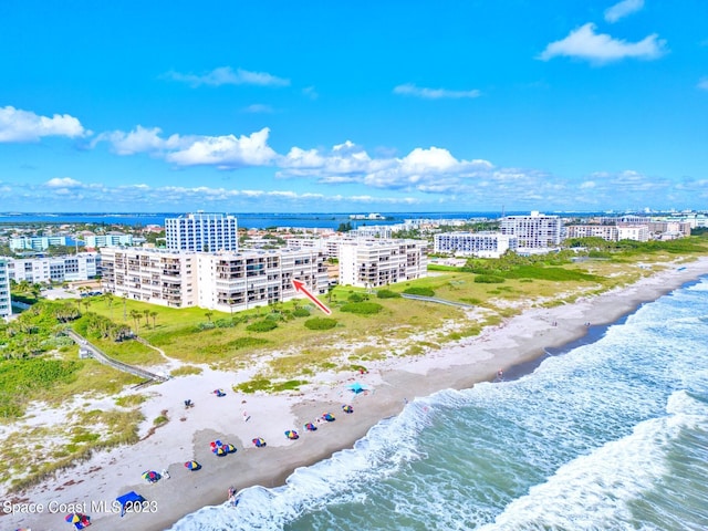 bird's eye view with a beach view and a water view