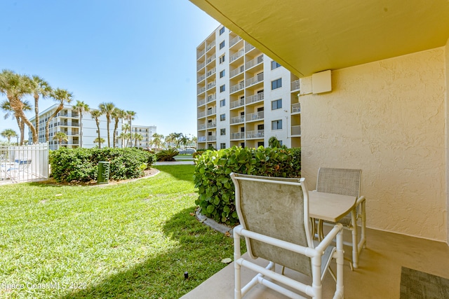 view of yard featuring a balcony