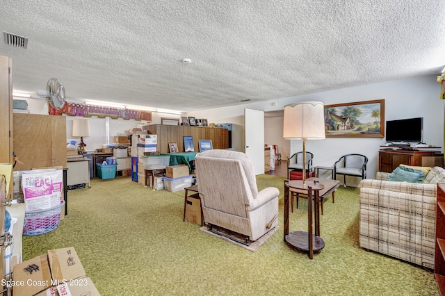 living room with light carpet and a textured ceiling