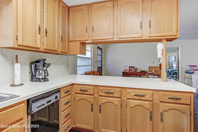 kitchen with light brown cabinetry, tasteful backsplash, kitchen peninsula, and dishwasher