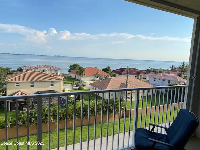 balcony featuring a water view