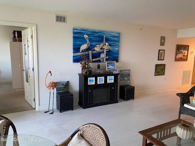 living room with light hardwood / wood-style flooring