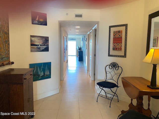 corridor featuring light tile flooring