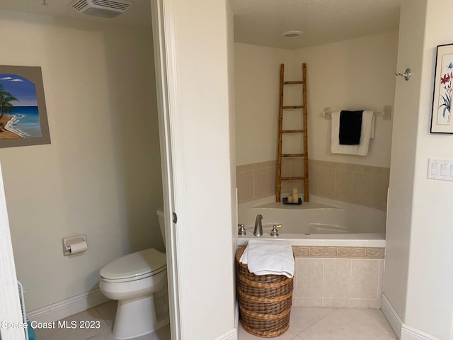 bathroom with toilet, a relaxing tiled bath, and tile flooring