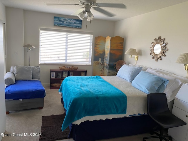 bedroom with light colored carpet and ceiling fan