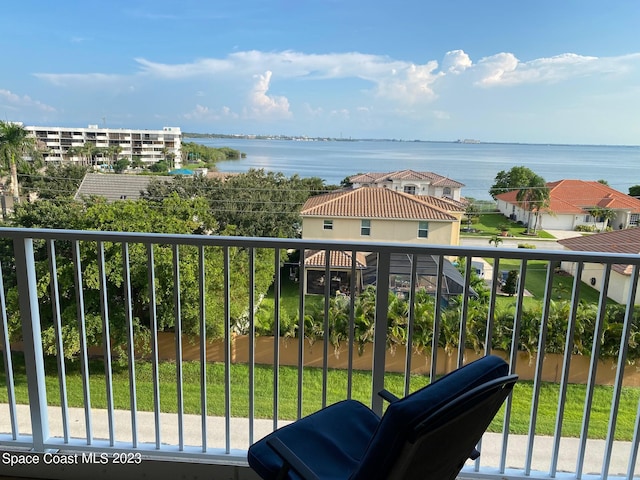 balcony featuring a water view