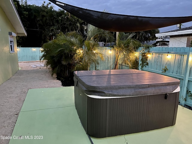 view of terrace featuring a hot tub