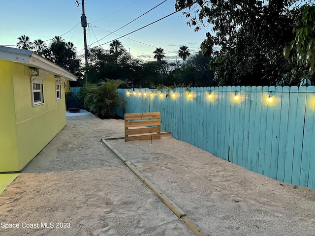 view of yard at dusk