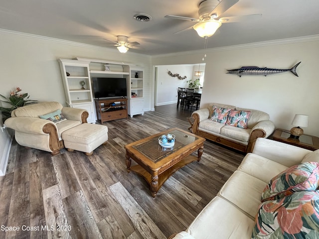 living room with ornamental molding, dark hardwood / wood-style flooring, and ceiling fan