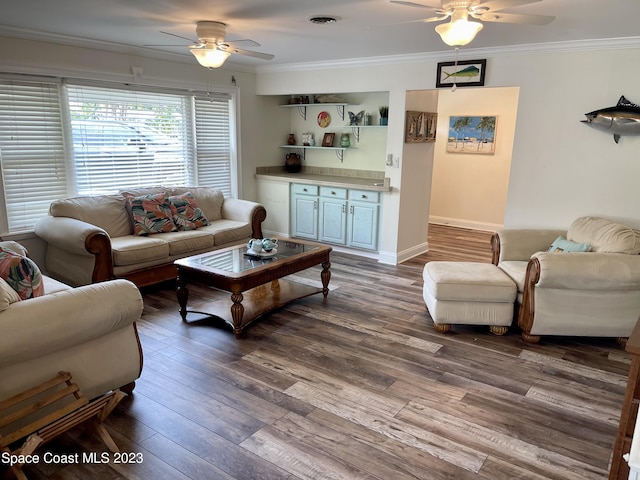 living room featuring wood-type flooring, ceiling fan, and ornamental molding