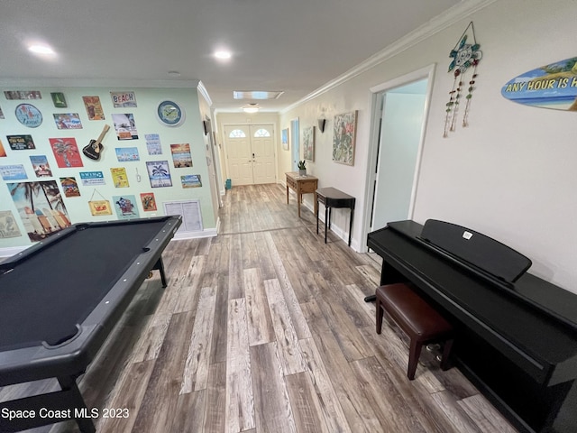 corridor featuring hardwood / wood-style flooring and ornamental molding