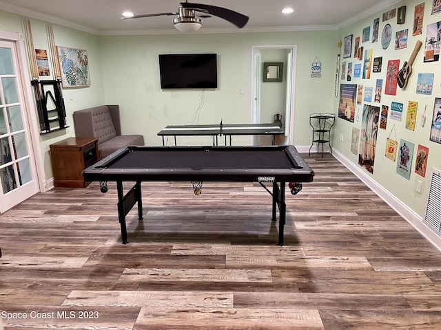 recreation room with pool table, dark hardwood / wood-style floors, ceiling fan, and ornamental molding