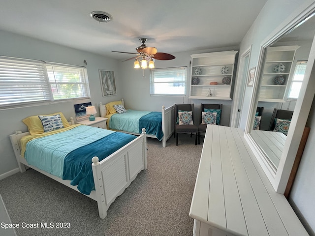 bedroom featuring light carpet and ceiling fan