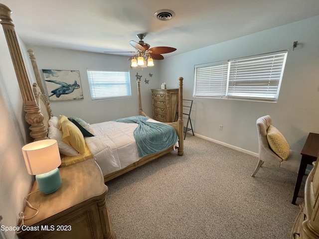 bedroom featuring light carpet and ceiling fan