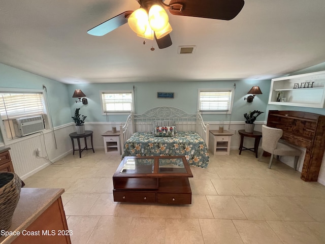 living room featuring plenty of natural light, vaulted ceiling, ceiling fan, and light tile floors