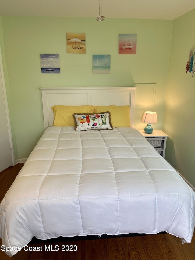 bedroom with hardwood / wood-style floors