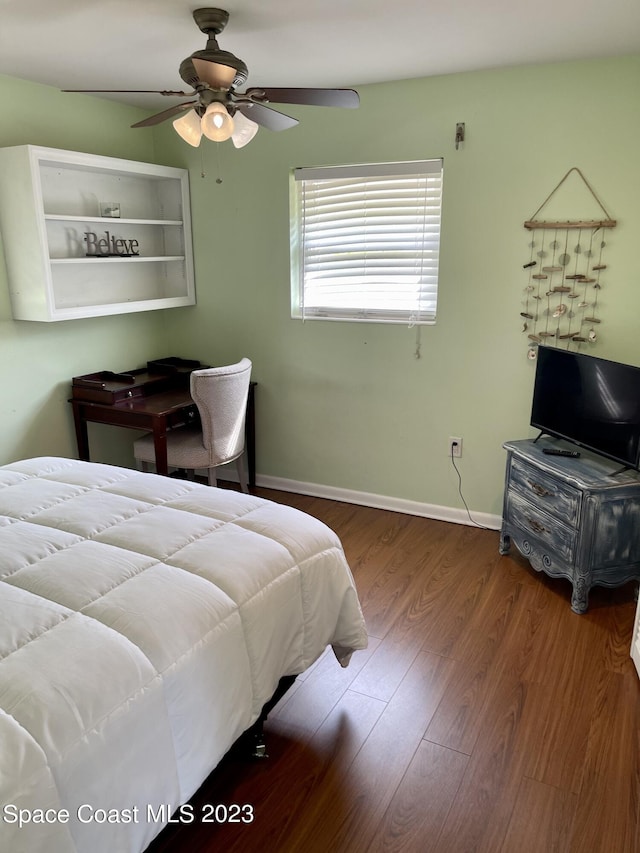 bedroom featuring dark hardwood / wood-style flooring and ceiling fan