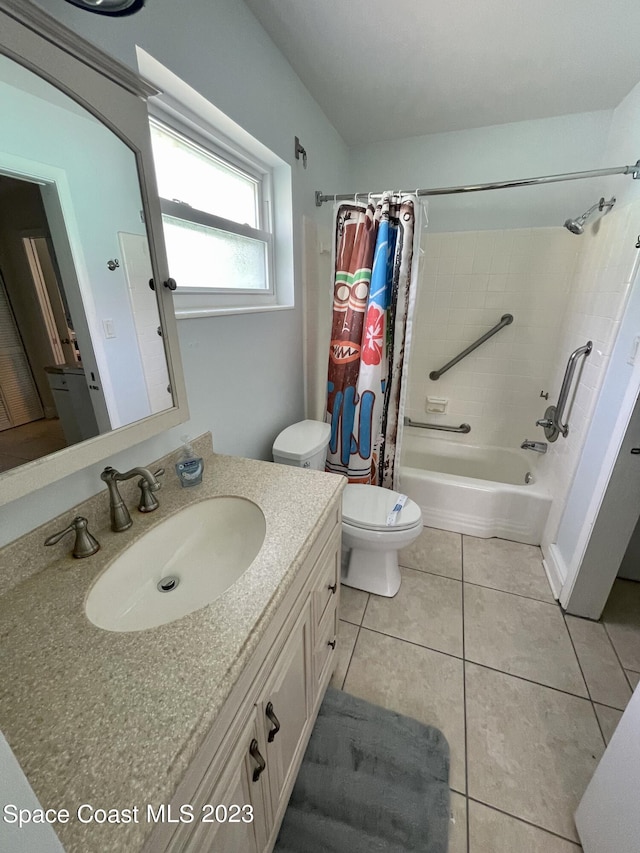 full bathroom featuring toilet, vanity, shower / tub combo with curtain, and tile flooring