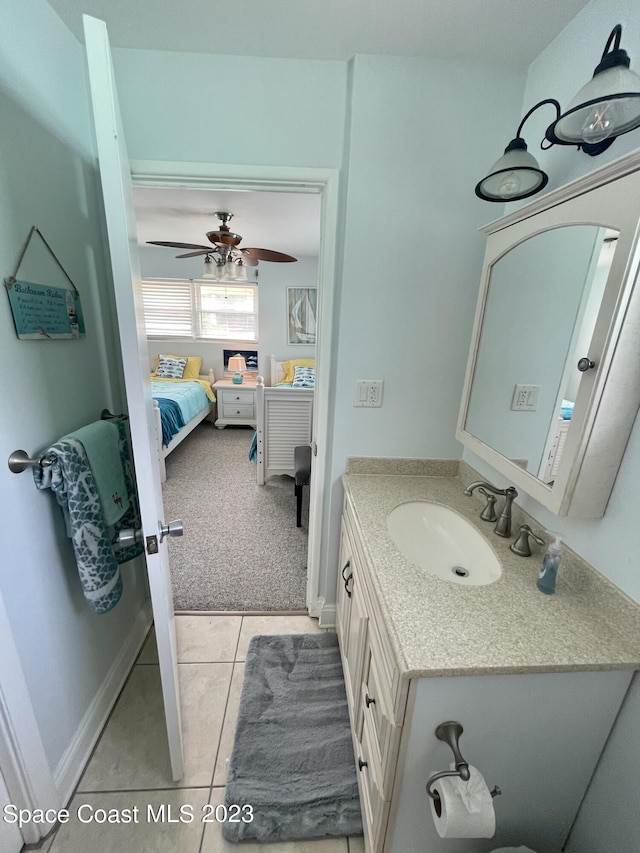 bathroom featuring tile floors, ceiling fan, and oversized vanity