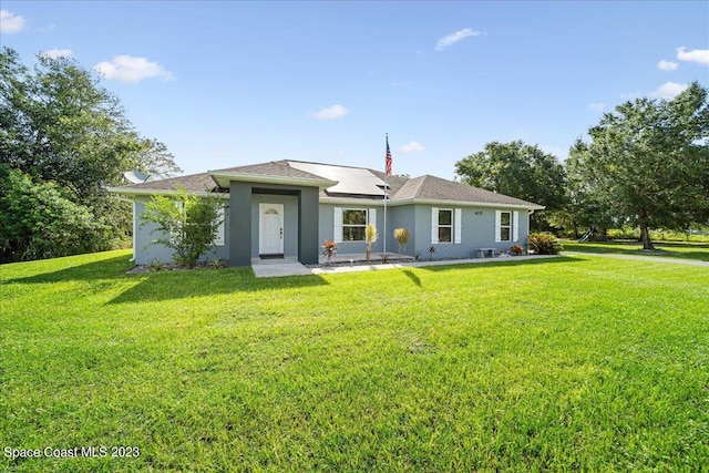 ranch-style house with a front lawn