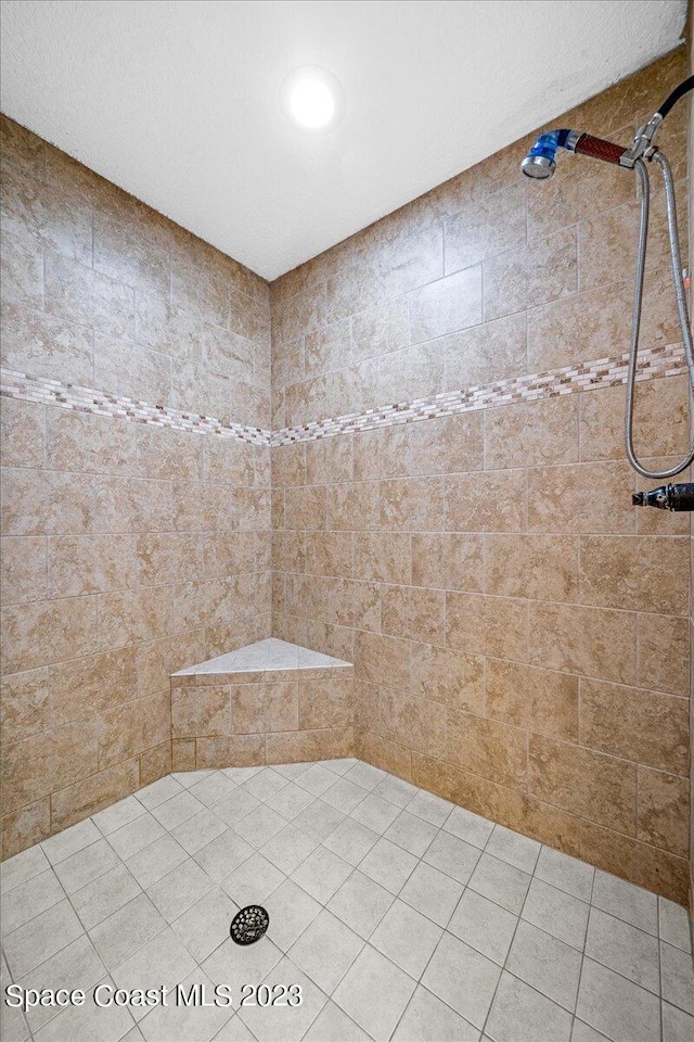 bathroom with tiled shower