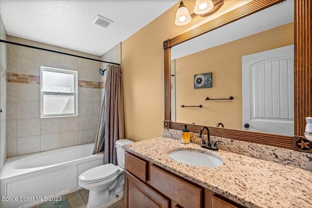 full bathroom with vanity, shower / tub combo with curtain, a textured ceiling, tile flooring, and toilet