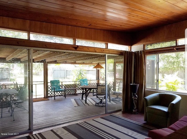 sunroom featuring wooden ceiling