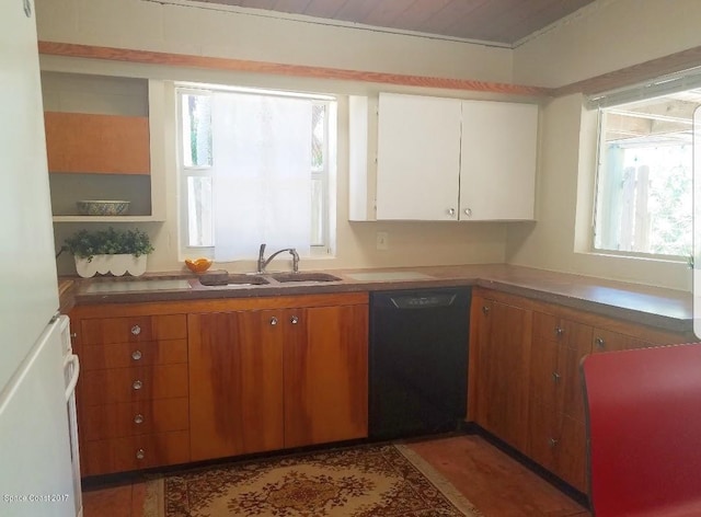 kitchen featuring white cabinets, white fridge, dishwasher, and sink